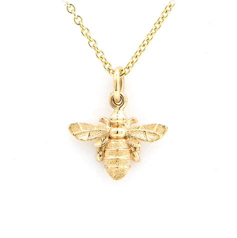 solid gold bee necklace.